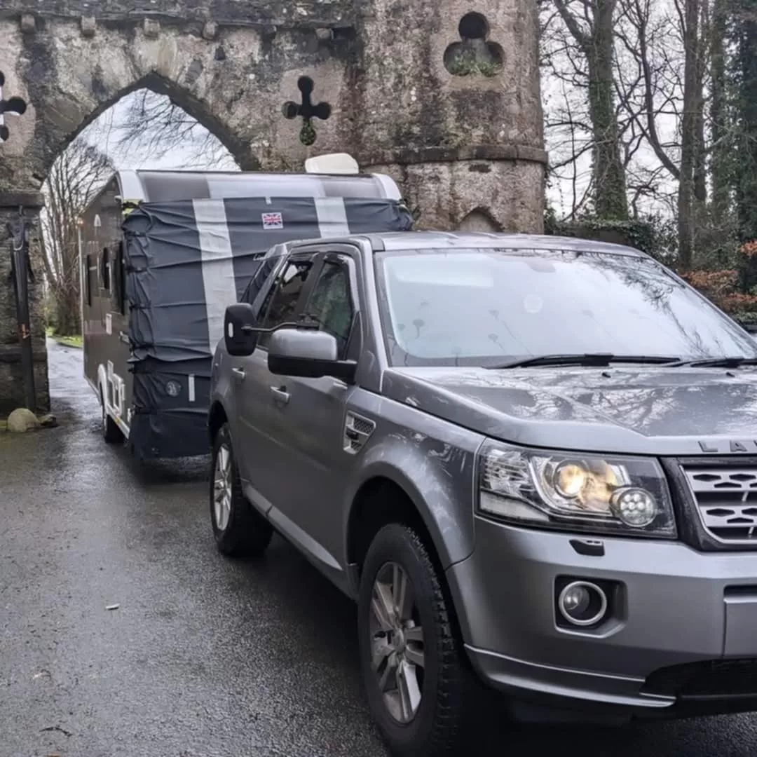 Why is it important to have a towing cover on your caravan?